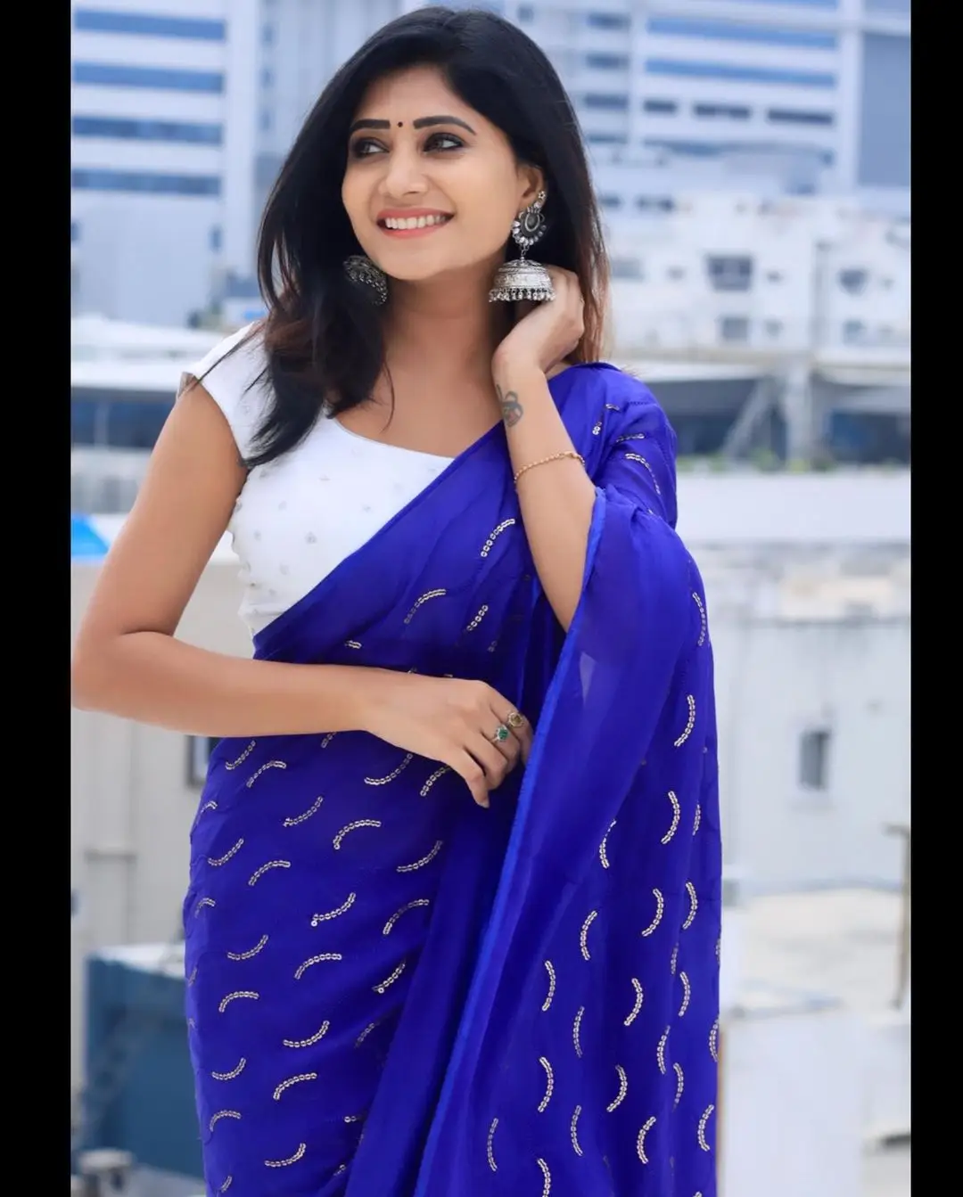 Vasanthi Krishnan Wearing Blue Saree White Sleeveless Blouse